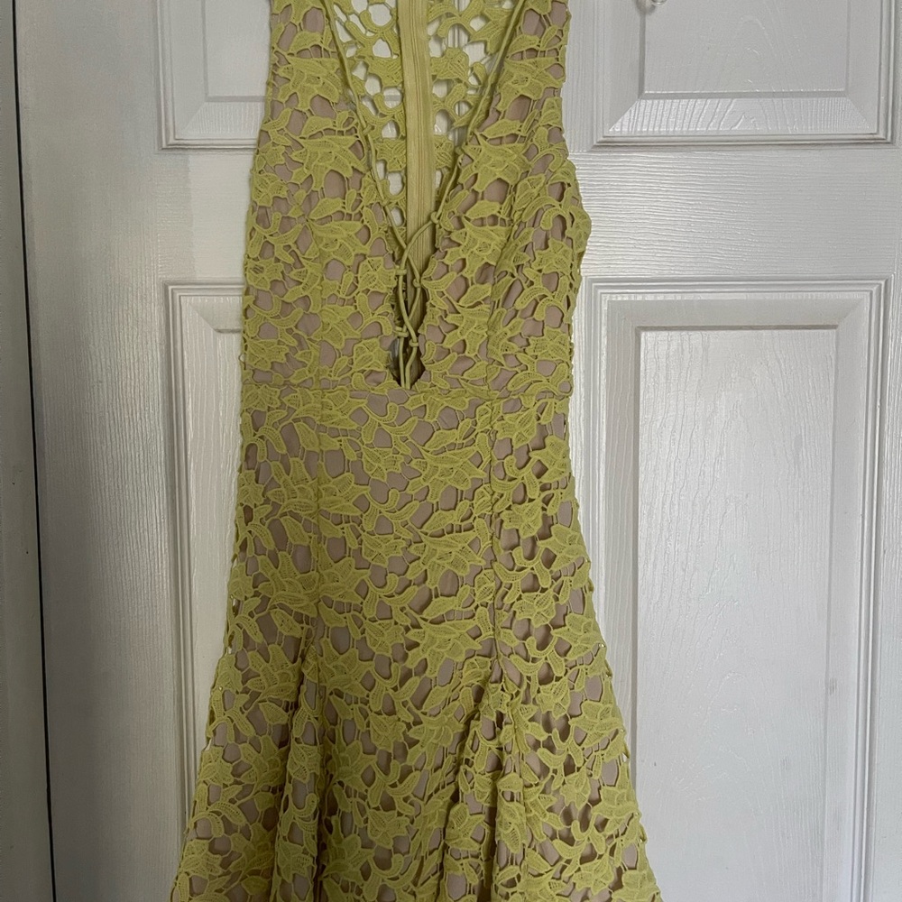 Elegant Lace Sleeveless Dress in yellow.